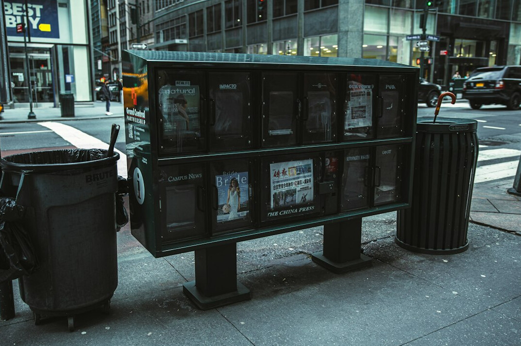 Stack of printed newspapers on a table